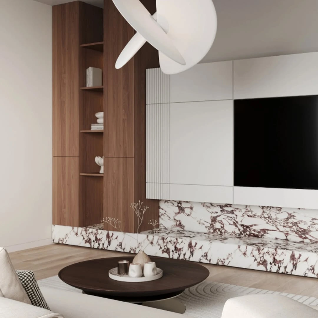 TV ünitesinde Calacatta Brown mermer kullanılan bir oturma odası